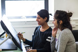 Film Animation Video students working at a digital drafting table