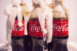 A sculpture of overflowing Coca-Cola bottles by Glass alum Qian Liao