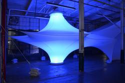 a large, blue-lit installation sprawls in the Interior Architecture studio