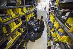 Photo equipment on shelves and in containers.