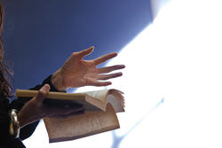 professor reading aloud from a book