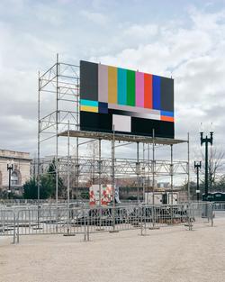 Student work by Chase Barnes MFA 2018. Photograph of a billboard displaying SMPTE color bars.