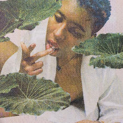 Photo of a person licking their finger among large leaves printed on fabric