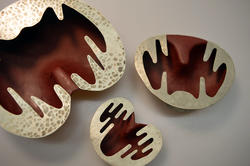 three heart shaped brown and gold bowls