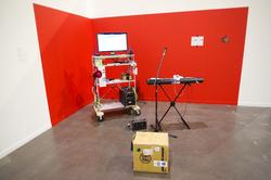 Art piece by Yu Chih Hao, MFA 2014. Musical keyboard and microphone staged next to computer.