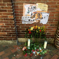 Memorial with candles and posters