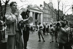 Man at protest holding megaphone