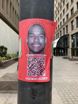 Red-poster-on-street-lamp