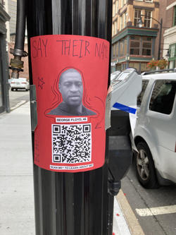 Red-poster-on-street-lamp