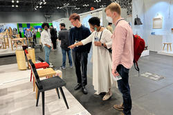 ICFF visitors discuss work on display