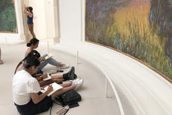 students sketching in a museum