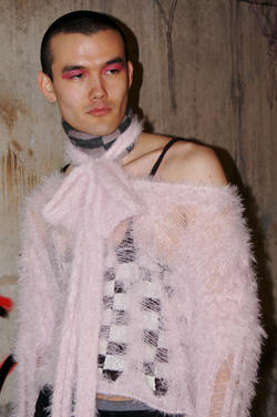 a model wears a fuzzy pink top designed by Amanda Glickman