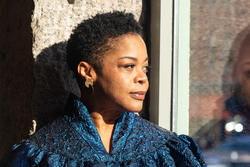 R I S D President Crystal Williams looks rightward through a sunlit window