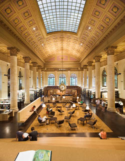 A downward-looking view of the Fleet Library’s golden-brown main hall