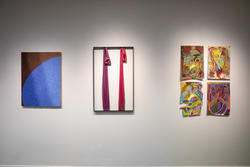 a painting, mixed-media installation, and group of four small paintings on a gallery wall