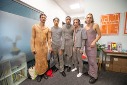 a group of models stand together wearing striped knitwear garments by tito chrichton stuart