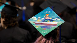 a beautifully illustrated mortaboard at Commencement 2023