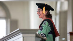 Graduate Hooding 2023 speaker and Board of Trustees co-chair Ilene Chaiken at the podium