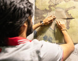 Architecture student Pai Liu presents a manipulated map at final crits, spring 2023