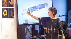 Grad student Felicia Neuhof presents her team's projects at final crits in spring 2023
