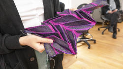 the woven textile folds open in the same way an earwig's wing unfolds