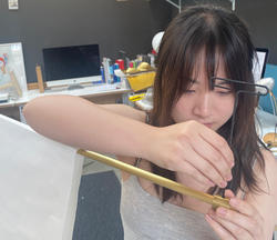 Cissy Huang prepares paper models of David Weeks' lighting design ideas