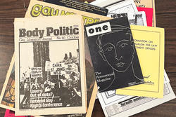 Queer Zines and magazines piled up on a table