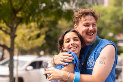 Res life students hug during 2023 move-in