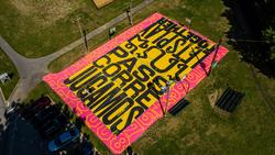 Painted basketball court designed by Lois Harada.