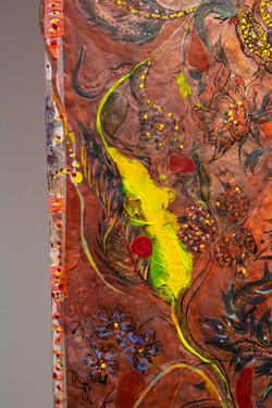 a close-up of details of a painting, with a yellow streak of paint surrounded by mostly red and brown tones