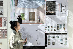 a student points to architectural documents pinned on a wall