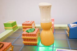 several colorful toys shaped like food products atop a lit surface