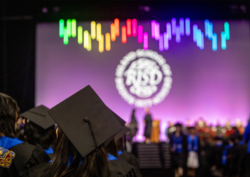 Image from Commencement 2024 students looking toward a stage
