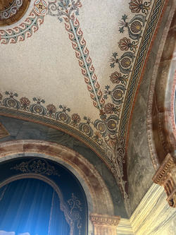 a ceiling composed of ornately arranged mosaic tile