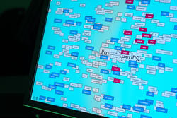 Student work by Graphic Design alum Zach Scheinfeled of a screen with many words on top of a blue background.