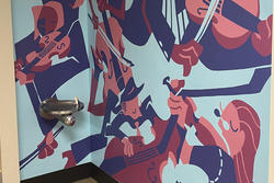 An illustration painted on a wall of string musicians