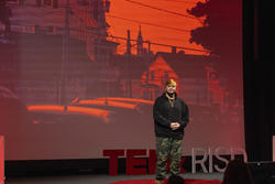 Prophet gives a speech at TEDxRISD