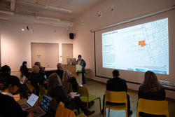 A group listens to a presentation