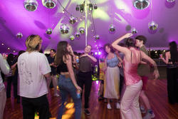 A group of students are dancing at RISD’s artist party celebration event.