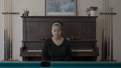 A still from a film showing a girl with her eyes closed