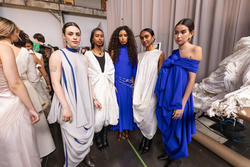 A group of models featuring a collection by Nura Dhar