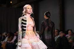 A model walking down a runway