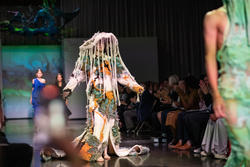 A model walking down a runway